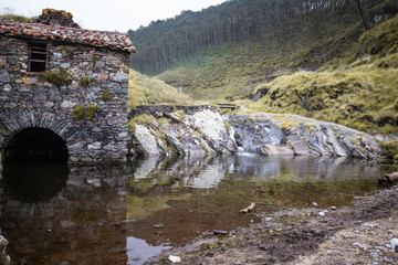 ancient mill beside the shore