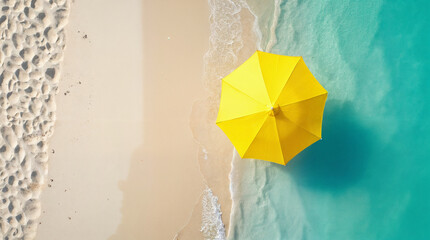 Single yellow beach umbrella on sandy shore with turquoise water  