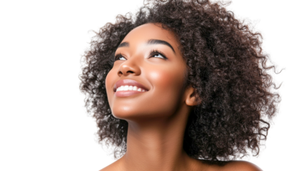 Portrait of a smiling young Black woman with curly hair looking up, hopeful expression, close-up shot against a dark background