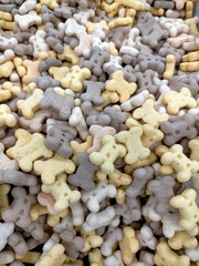 white pebbles background
Tasty dog ​​biscuits in close-up, a treat for our pets.