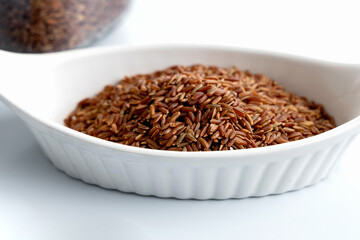 Close up healthy uncooked raw red rice