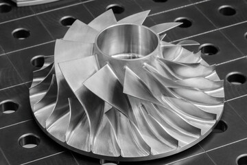 Large metal turbine on table of industrial metalworking programmable CNC machine, industrial...