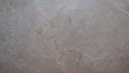 grey stone with a red line running through it. The stone is rough and has a rustic feel to it