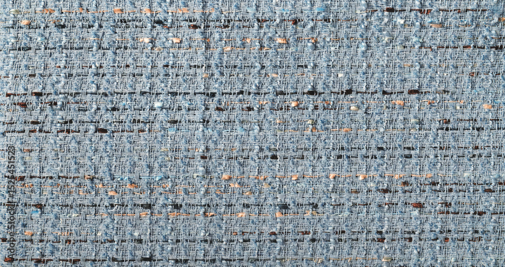 Poster blue and brown fabric with a pattern of blue and brown. the fabric is made of wool and has a rough t