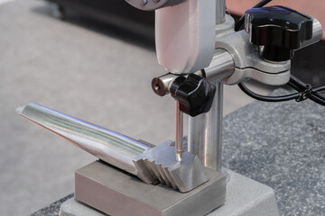 Quality control on milling metal CNC machine, coordinate measuring machine tests turbine blade, CMM Quality control machine, technology concept