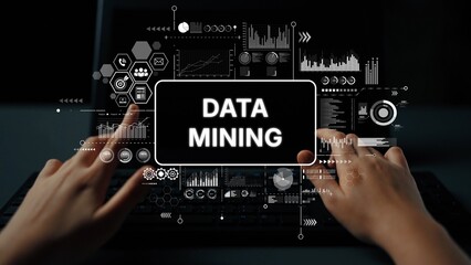 Hands Typing on Keyboard with Data Mining Graphics and Analytics Visualizations on Screen in Modern...