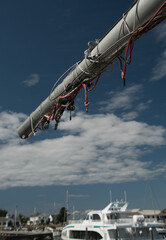 Bowsprit with red cables  reaches for blue skies - 2
