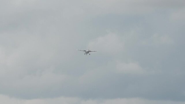 Cessna 208B Grand Caravan G-BZAH light aircraft on approach to landing on a grass runway