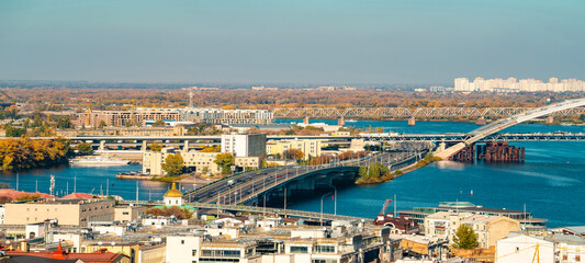 Kyiv cityscape with bridges over Dnipro River, panoramic view