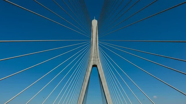 Architectural marvels: A symmetrical view of a modern bridge against blue skies