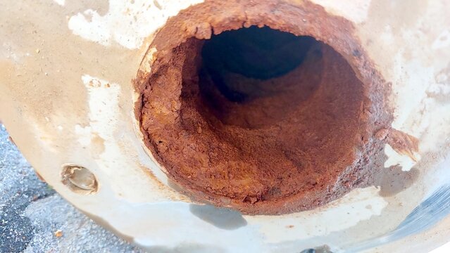 Rust and Clay Deposits in Artesian Well Pipe Showcase Water Quality Issues and Aging Infrastructure