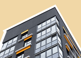 Modern highrise apartment building with glass windows and structured facade. Urban residential block