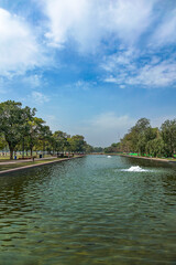 An water lake and garden with lots of trees which is man made nature restored place.