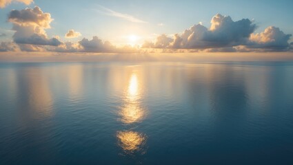 Naklejka premium Calm ocean during sunset with the sun reflected on the water surface and scattered clouds in the sky.