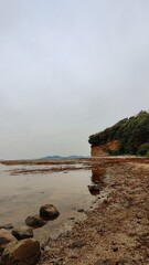 Beach on the dirty sea coast