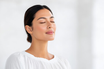 portrait of massage therapist positioned to left displaying calm expression