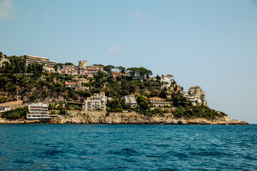 Nice, France - July 2, 2014: Views from the water of the buildings, homes and beaches along the shores surrounding Nice, France, in the French Riviera

