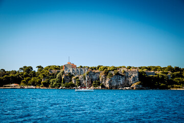Nice, France - July 2, 2014: Views from the water of the buildings, homes and beaches along the shores surrounding Nice, France, in the French Riviera
