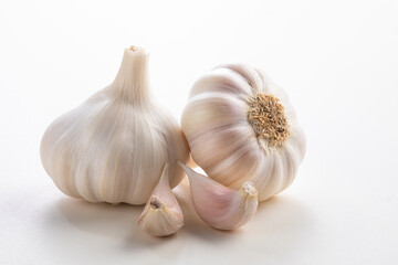 garlic bulb with cloves on a white background