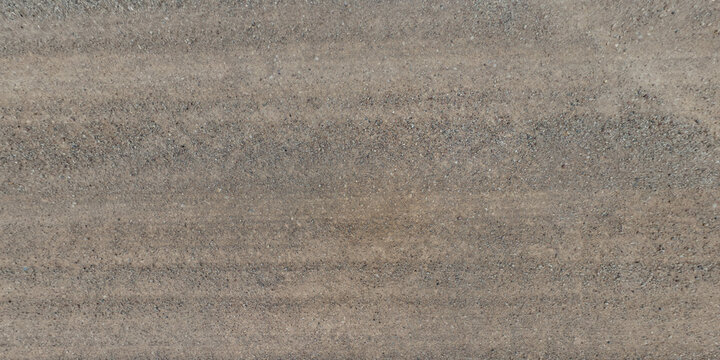 top view of gravel road surface and grass shoulder