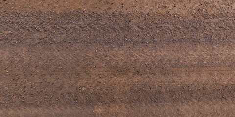 top view of gravel road surface and grass shoulder