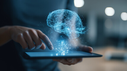 A holographic blue brain appears above a tablet being used by a person.
