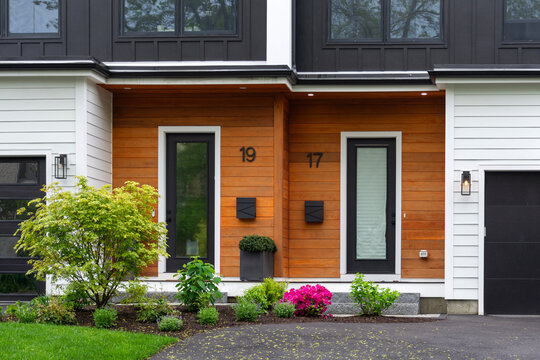 Front entry of a modern duplex house on a spring day in Newton, Massachusetts, USA