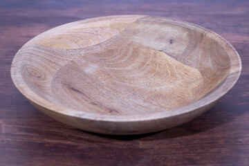 close-up of an empty deep wooden bowl