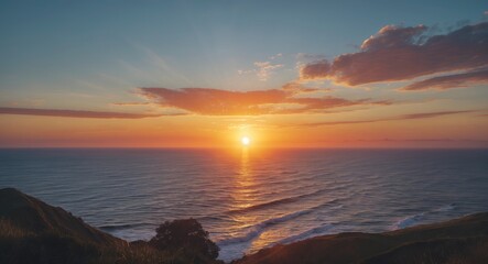 Obraz premium Sunset over the ocean viewed from a coastal landscape. Nature and scenery, beauty of the outdoors, tranquility, and scenic moments.