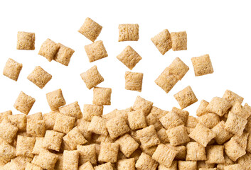Crispy corn pads scattered in a white background, top view.