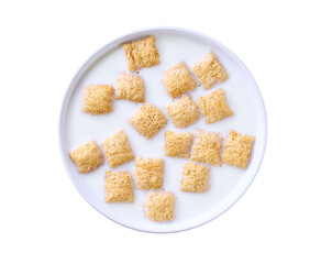 corn pads with milk in a bowl isolated on a white background, top view.