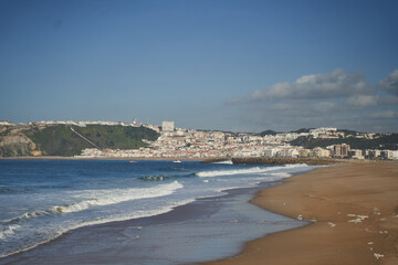 The stunning shoreline features calm waves along with charming seaside architecture that captivates visitors