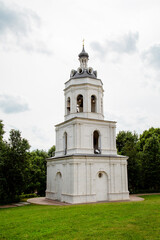 The bell tower in the Dubrovitsy manor on a clear sunny day. Sights of Moscow, World tourism.