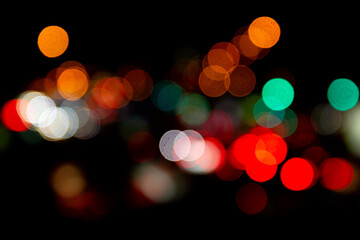 Multicolored lights bokeh background. bokeh texture of street colored lights