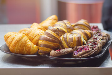 Fresh croissants on counter at bakery