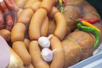 Delicious fresh sardines and sausage on store shelves