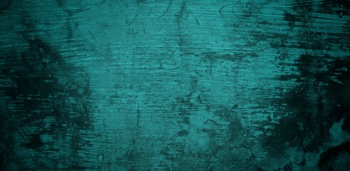 A textured background featuring a deep teal color with a distressed, grunge appearance. The surface shows variations in tone and subtle patterns, creating an abstract and moody aesthetic.