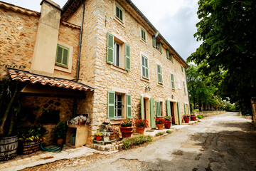 Seillans, France - July 3, 2014: A rustic building along an alleyway in the provencal village of Seillans, France
