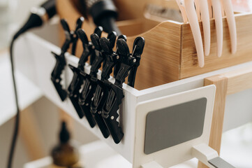 Close‑up of hair claw and sectioning clips used in spa scalp treatment session