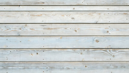 Naklejka premium Lightly painted wooden planks create a textured background surface