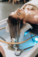 Scalp treatment spa using circulating shower water system for professional head wash therapy.