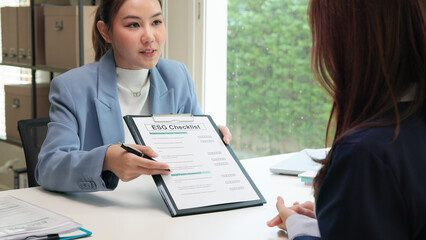 Asian female audit ESG risk check list paper form net zero waste supply chain vendor eco go green...