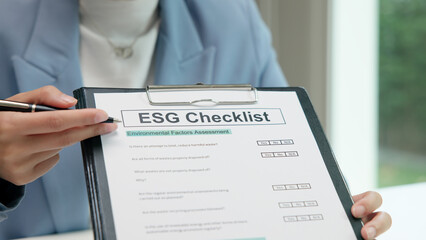 Asian female audit ESG risk check list paper form net zero waste supply chain vendor eco go green...