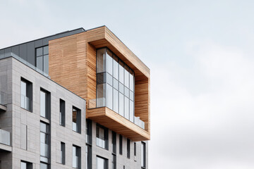 closeup of modern wooden building facades highlighting light shades and textures