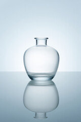 meticulously arranged studio shot of delicate glass vase featuring ultrabright lighting to enhance its contours and