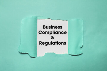 Torn Paper Revealing Business Compliance Regulations.
