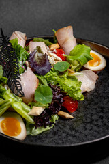 Plate of Fresh Green Salad with turkey ham, mozzarella and tomato isolated on white background