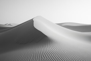 Monochromatic desert scene with sand dune and shadows. Includes beach, nature, landscape elements.