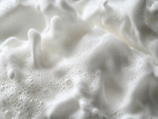 Soapy froth forming bubbles in water.
