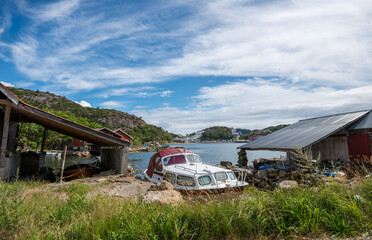 Rustic boat shed by waterfront.